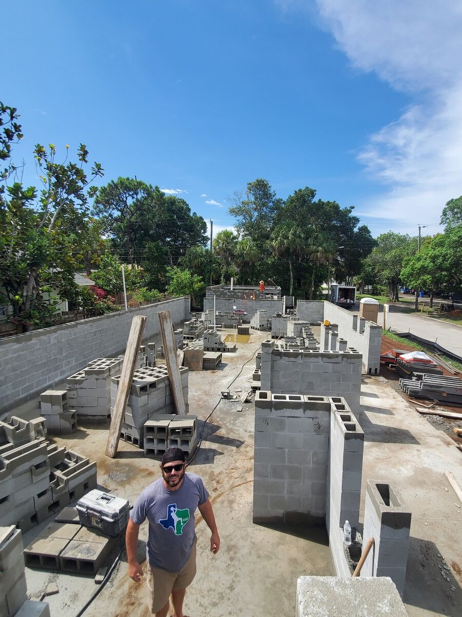Block wall construction in progress on a residential site