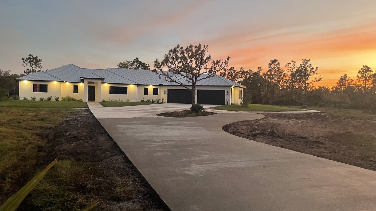Custom home at dusk built by Beach Star Construction