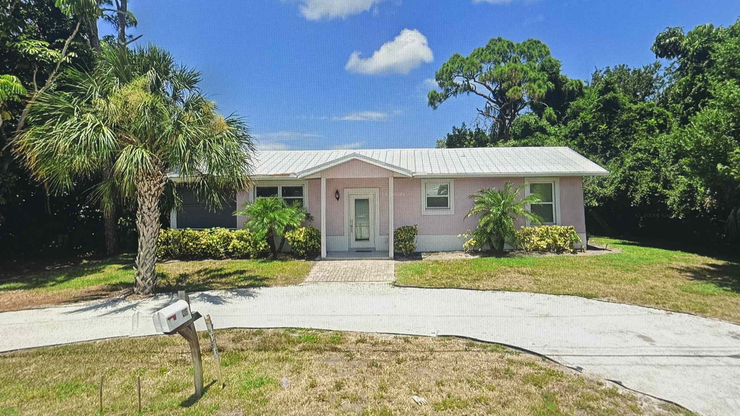 Single-story Florida home with a new standing-seam metal roof, renovated by Beach Star Construction