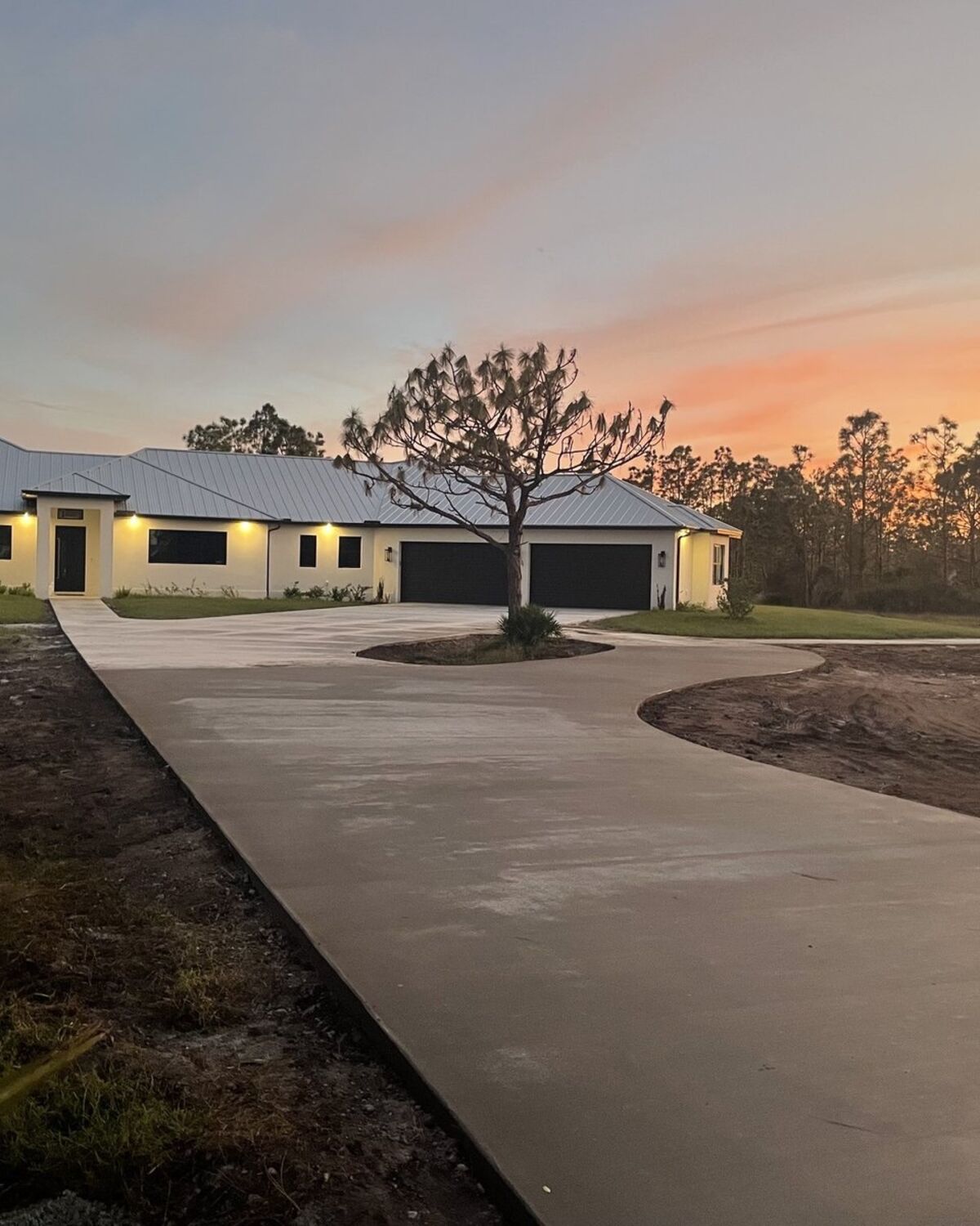 Finished custom home exterior at dusk